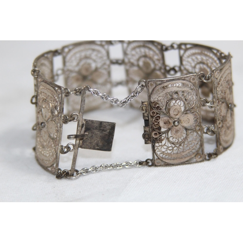 863 - MIDDLE EASTERN SILVER FILIGREE PANELLED BRACELET, 26.11 GRAMS