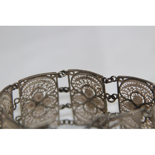 863 - MIDDLE EASTERN SILVER FILIGREE PANELLED BRACELET, 26.11 GRAMS