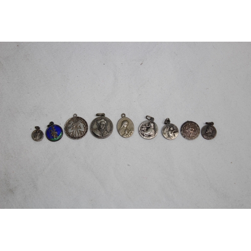 866 - SMALL COLLECTION OF 9 SILVER & WHITE METAL ECCLESIASTICAL PENDANTS ETC,15.34 GRAMS'