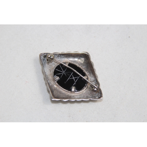 874 - CARVED STONE SET SILVER BROOCH, 11.36 GRAMS