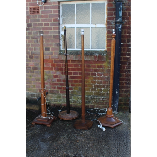 152 - FOUR  WOODEN STANDARD LAMPS 
172CM