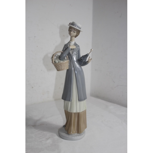 712 - NAO FIGURINE OF WOMEN WITH FLOWERS AND UMBRELLA 
37CM