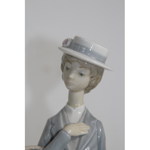 712 - NAO FIGURINE OF WOMEN WITH FLOWERS AND UMBRELLA 
37CM