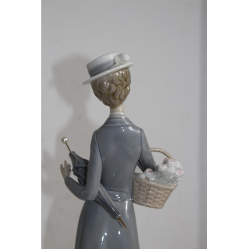 712 - NAO FIGURINE OF WOMEN WITH FLOWERS AND UMBRELLA 
37CM