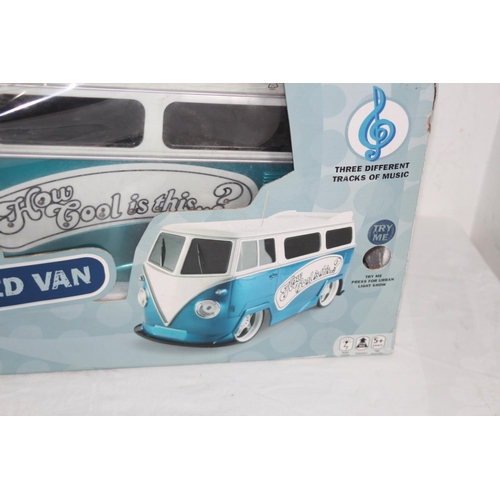 541 - RADIO CONTROL VW CAMPER IN BOX AND TWO OTHERS 
45 X 20CM