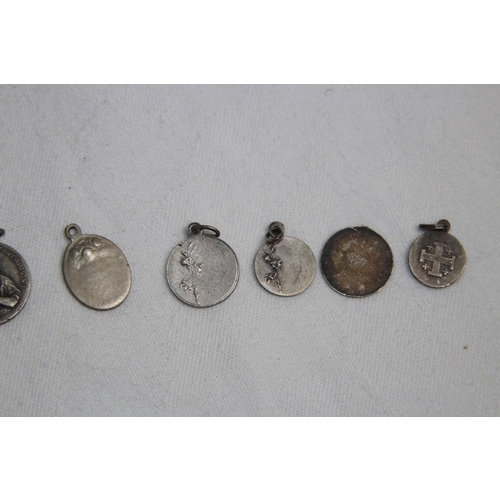 866 - SMALL COLLECTION OF 9 SILVER & WHITE METAL ECCLESIASTICAL PENDANTS ETC,15.34 GRAMS'