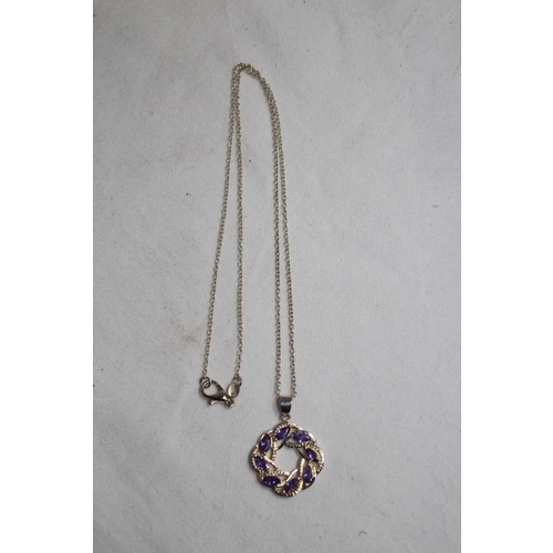 871 - CELTIC DESIGN PENDANT NECKLACE SET WITH AMETHYST COLOURED STONES