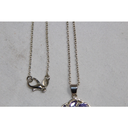 871 - CELTIC DESIGN PENDANT NECKLACE SET WITH AMETHYST COLOURED STONES