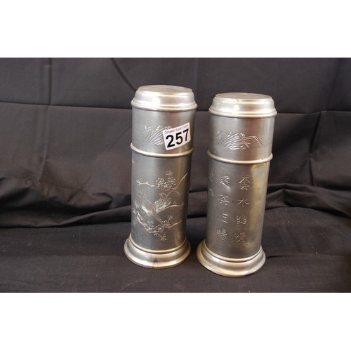 257 - Two Pewter Oriental Flasks
Standing 9