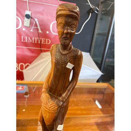 83 - Wooden Tribal Carving Of A Man Standing At 15”.