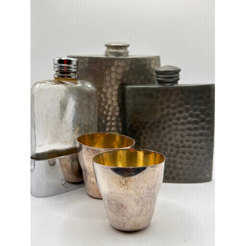 1 - Three Vintage Hip Flasks Along with a Pair Of Plated Shot Beakers.