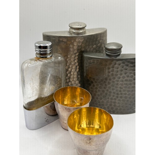 1 - Three Vintage Hip Flasks Along with a Pair Of Plated Shot Beakers.