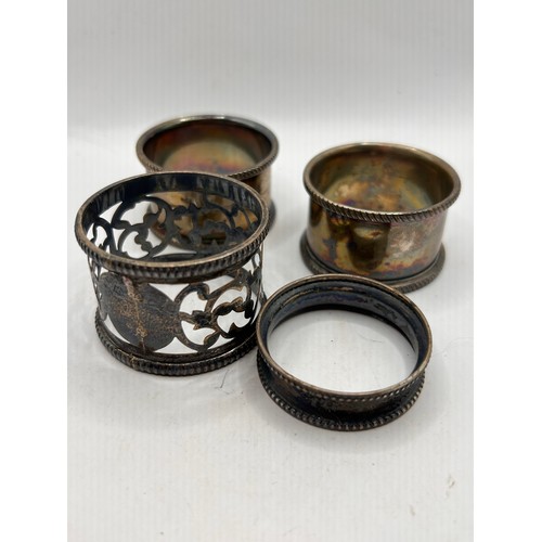 35 - Tub Of Four Napkin Rings, At Least Two Are Silver.