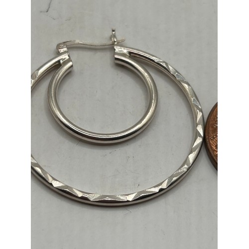 259 - Pair Of Silver Double Loop Earrings.