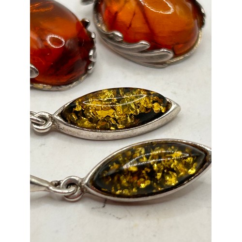 267 - Two Pairs Of Silver And Amber Earrings.