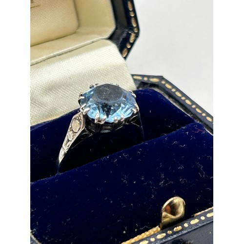 903 - Nice Looking Silver Ring With Blue Stone And Decorated Shoulders.