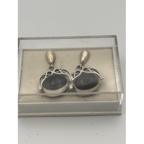 240 - Pair of Spinning Silver Drop Earrings, Blue/Black Polished Stone.