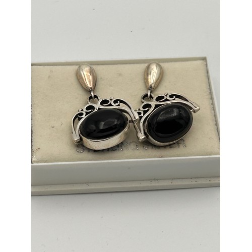 240 - Pair of Spinning Silver Drop Earrings, Blue/Black Polished Stone.