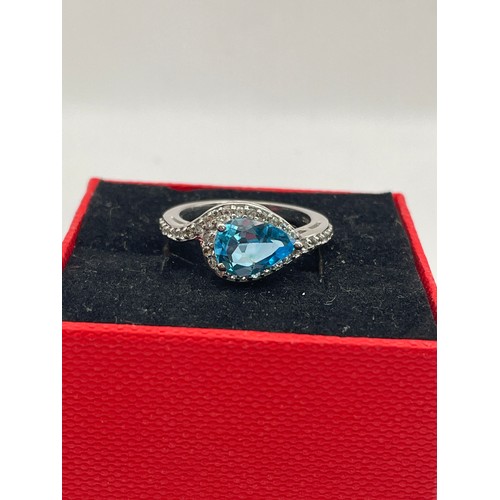 243 - Silver Ring With Blue Tear Drop Stone.