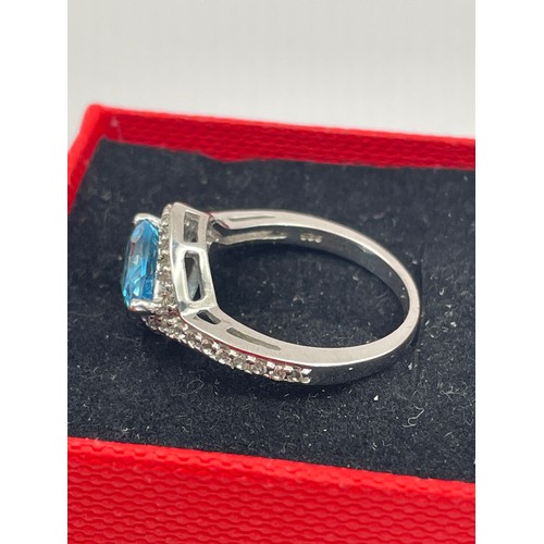 243 - Silver Ring With Blue Tear Drop Stone.