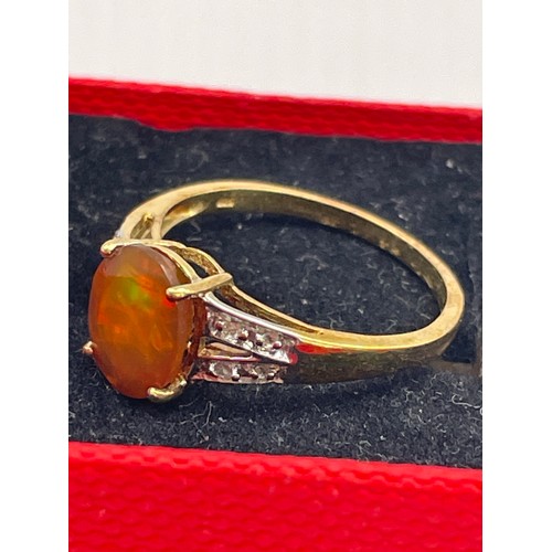 255 - Silver , Gold Coloured Ring With Orange Oval Stone.