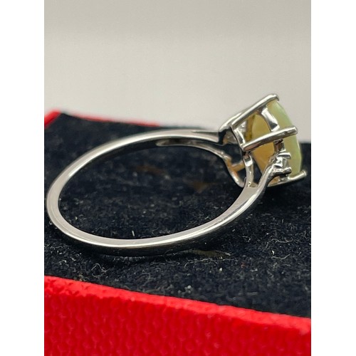 261 - Silver Ring With Ivory Coloured Oval Stone.