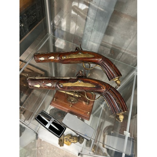 599 - Two Reproduction Brass And Wooden Pistols.