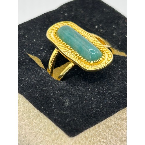 61 - Large Silver, Gold Coloured Ring With Green Stone.