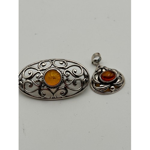 175 - Silver And Amber Brooch And Pendant Set.