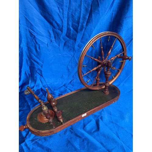 818 - Spinning Wheel 22” x 13”.