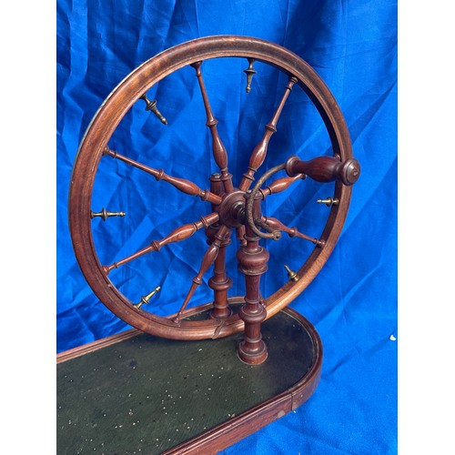 818 - Spinning Wheel 22” x 13”.