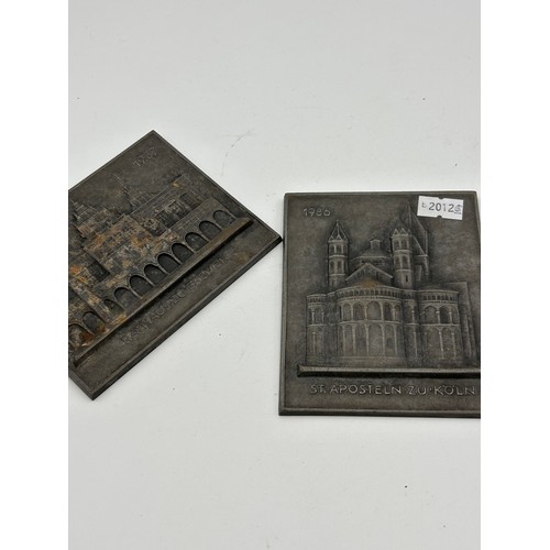 738 - Pair Of Buderus Iron Wall Plaques, Largest 4.5