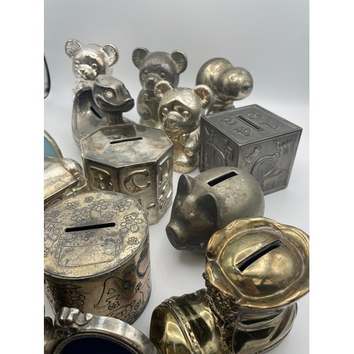 177 - Large Variety Of White Metal Money Box's.