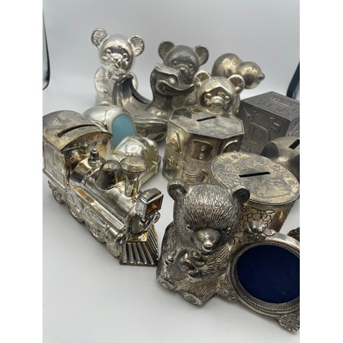 177 - Large Variety Of White Metal Money Box's.