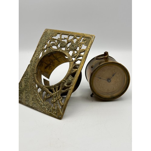 192 - Antique Brass Clock With Feature Surround , Appears over Wound. Frame 5.5