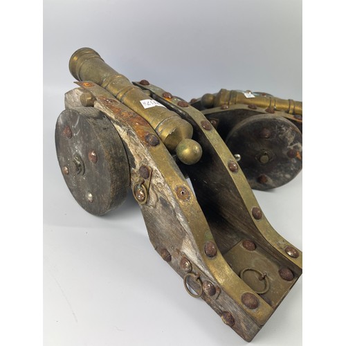 343 - Two Wood And Brass Decorative Cannons 13” x 5”.