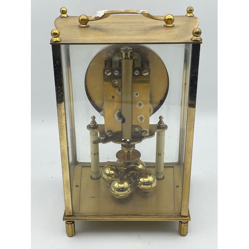 54 - Brass Kundo Clock With Floral Detail , 9.5.” X 5”.