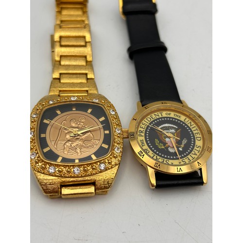 82 - Pair Of Gents Novelty Watches Including St Christopher, Both Require Batteries.