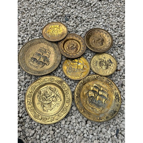 146 - Variety Of 8 Brass Charges Various Sizes And Designs Largest 18” In Diameter.