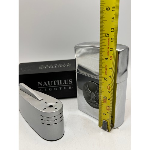 149 - Nautilus Table Lighter Along With over Sized Zippo Style Lighter.