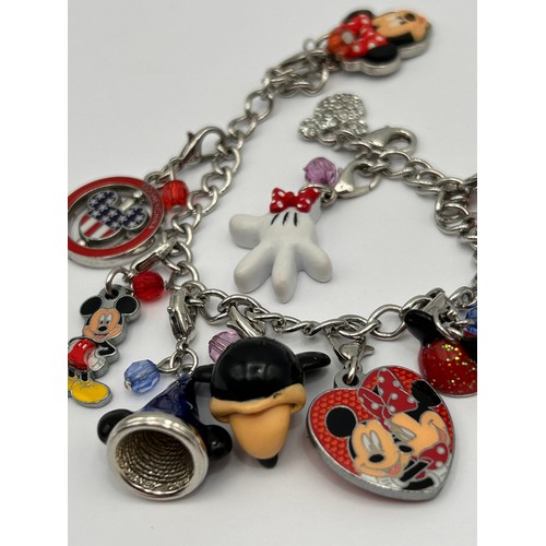 97 - Disney Charm Bracelet With Ten Charms.