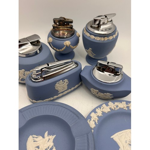 134 - A Collection Of Wedgwood Table Lighters And Ashtrays.