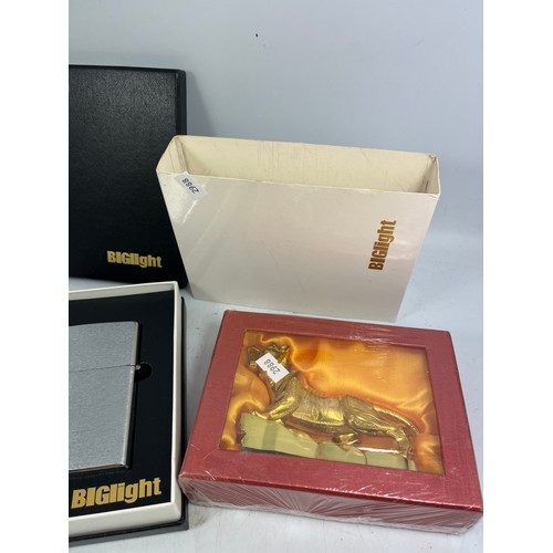 175 - 2 Boxed Table Lighters. One Stainless Steel One Tiger Figure