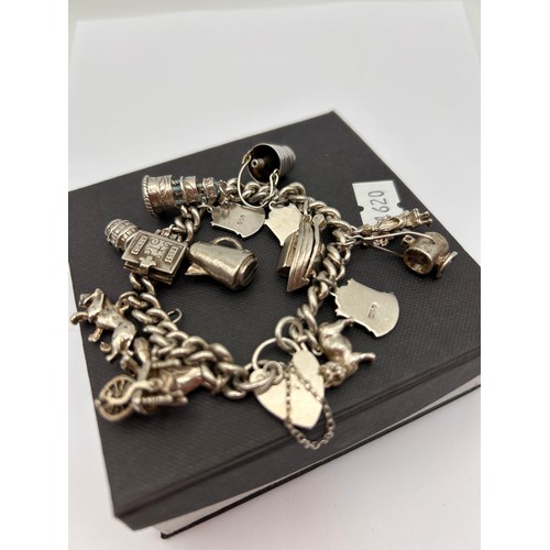 110 - Vintage Silver Charm Bracelet , With A number Of Silver Charms. 50g