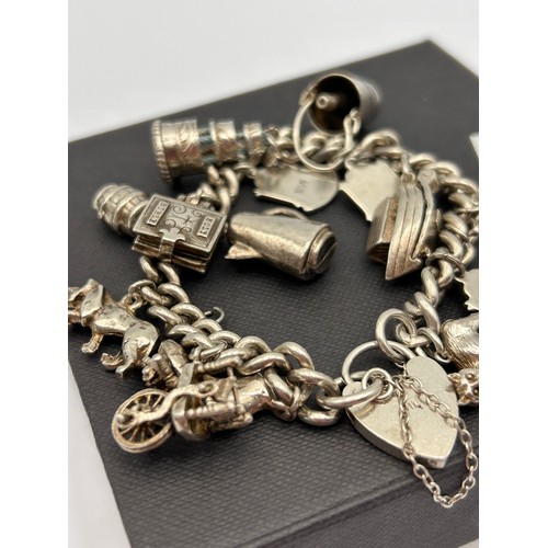 110 - Vintage Silver Charm Bracelet , With A number Of Silver Charms. 50g