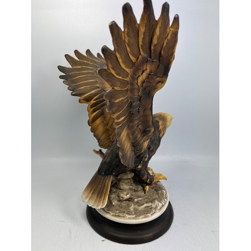 16 - Ceramic Hand Painted Eagle Figure Signed To Base Standing 11