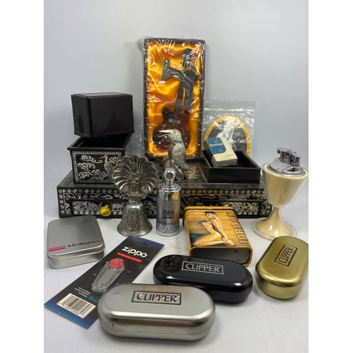 644 - Cigarette Dispenser , Clipper Tins , Table Lighter Etc.