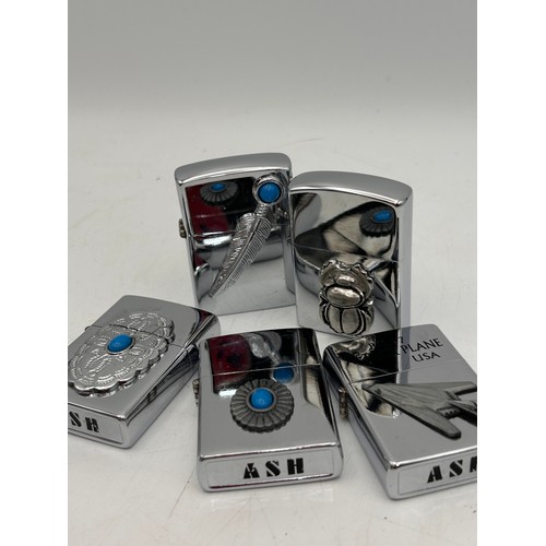 194 - A Collection Of Five Chrome Zippo Style Lighter.