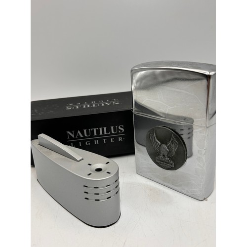 195 - Nautilus Table Lighter Along With over Sized Zippo Style Lighter.