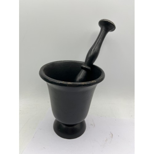 40 - Cast Iron Pestle And Mortar Standing 5”